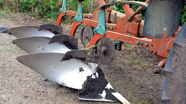 up close picture of plow in dirt