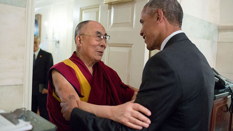 Dalai Lama shaking hands with President Barak Obama
