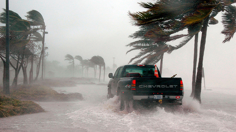 Pickup truck driving on road during hurricane