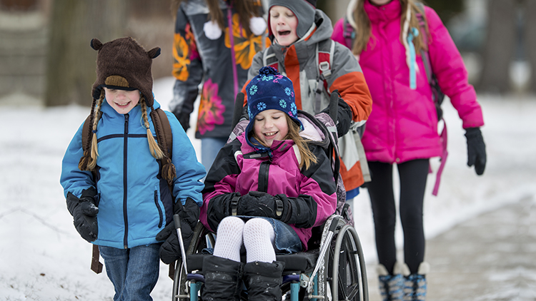 children walking to school during winter