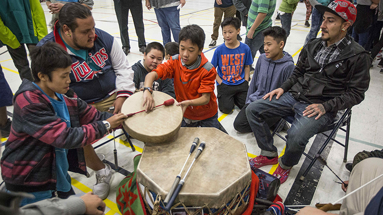 Members of the Redbone Singers drumming group answered student's questions during an activity portion of St. Paul's first official Indigenous Peoples Day at American Indian Magnet School in St. Paul, Minn., on Monday, October 12, 2015. ]