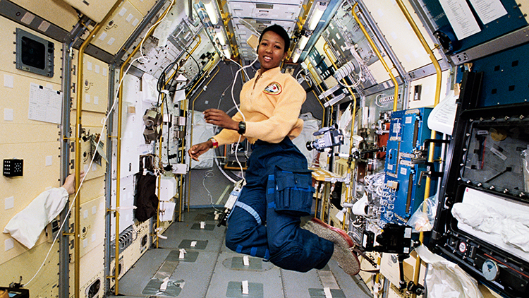 Mae Jemison floating aboard the space shuttle.